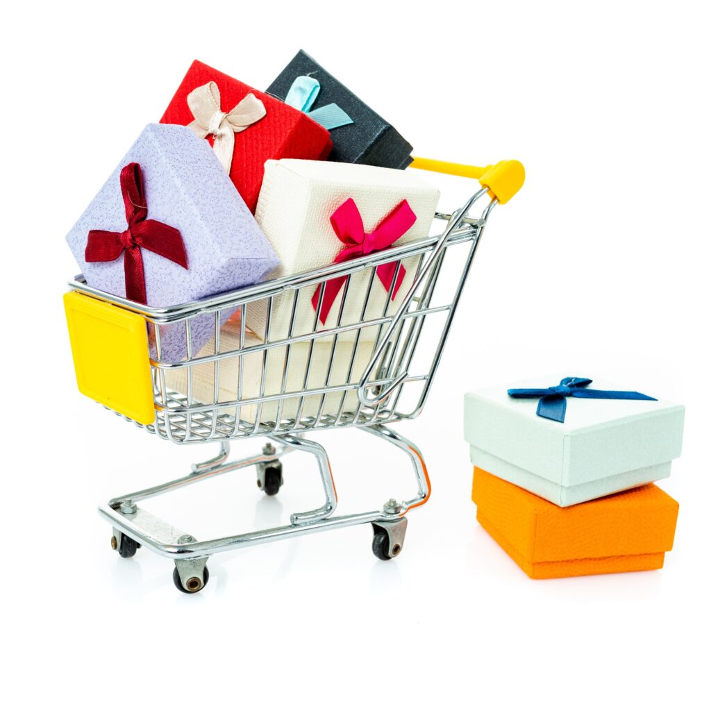 shopping cart with gifts isolated on white